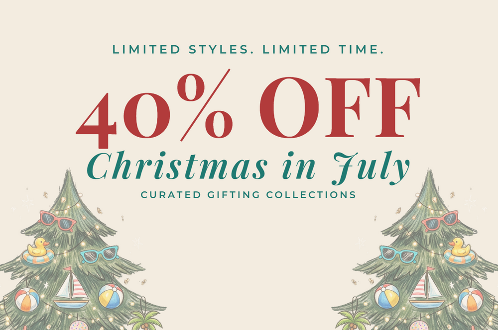 Promotional graphic for '40% OFF Christmas in July' featuring two illustrated Christmas trees decorated with beach-themed ornaments like sunglasses, flip-flops, shells, and ice cream cones on a light beige background.